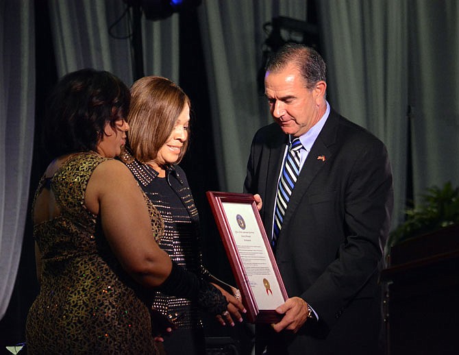 Lt. Gov. Mike Kehoe presents a proclamation to Ann McSwain, dean of the Lincoln School of Nursing, and LU President Jerald Jones Woolfolk on Saturday during the LU School of Nursing 50th Anniversary Gala at The Linc.