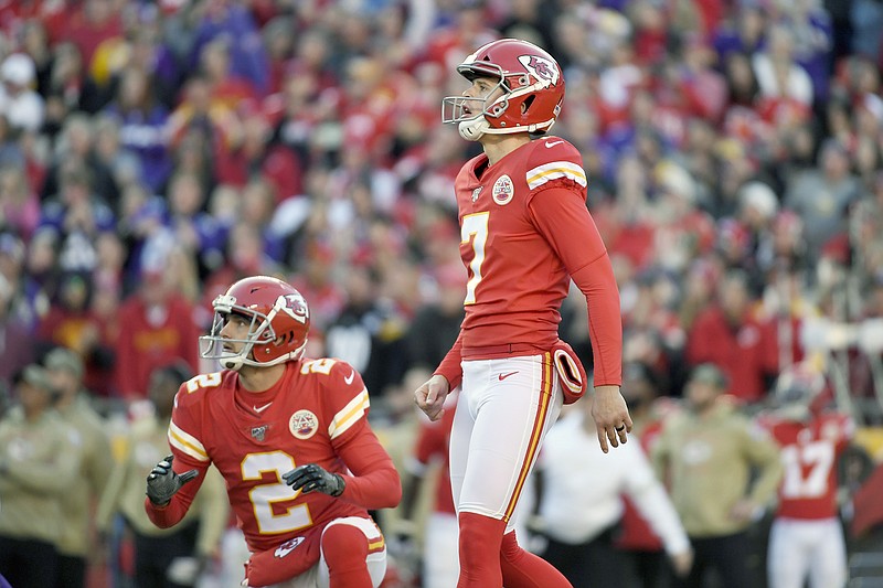 Chiefs kicker Harrison Butker (7) and holder Dustin Colquitt (2) follow the trajectory of Butker's game-winning field goal on the final play of Sunday afternoon's 26-23 win against the Vikings at Arrowhead Stadium.