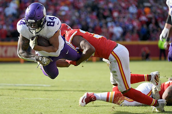 Vikings tight end Irv Smith Jr. is tackled by Chiefs cornerback Charvarius Ward during the second half of Sunday afternoon's game at Arrowhead Stadium.