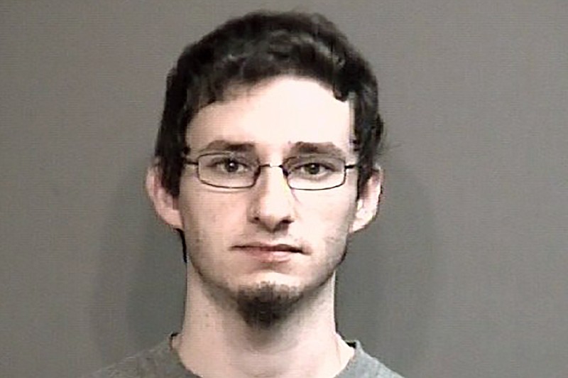 This undated photo provided by Boone County Sheriff's Department in Columbia, Mo., shows Joseph Elledge. The University of Missouri student was charged Monday, Oct. 28, 2019, with abuse or neglect of a child as authorities continue searching for his wife, Menqi Ji Elledge, a graduate of the school who is from China. (Boone County Sheriff's Department via AP)