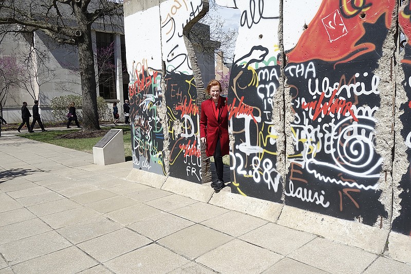 Artist Edwina Sandys, granddaughter to Sir Winston Churchill, poses with her "Breakthrough" sculpture next to the National Churchill Museum. The sculpture is carved from a piece of the Berlin Wall, which fell 30 years ago.