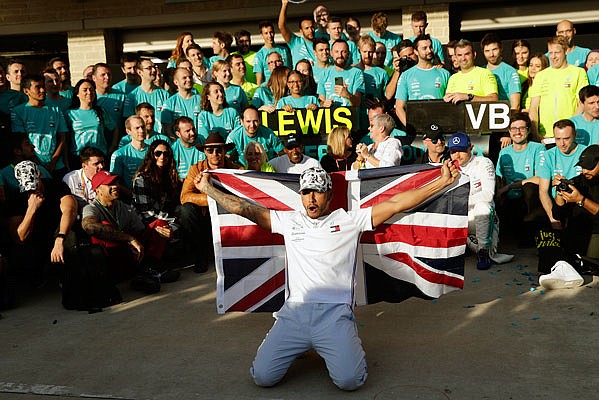 Lewis Hamilton celebrates Sunday following the Formula One U.S. Grand Prix at the Circuit of the Americas in Austin, Texas.