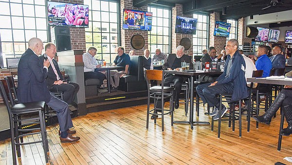 Former Missouri men's basketball coach Norm Stewart (far left) speaks Monday at Big Whiskey's. Stewart was the featured guest at the basketball tip-off luncheon hosted by Lincoln University that also had five local high school boys basketball coaches talk about their respective programs.