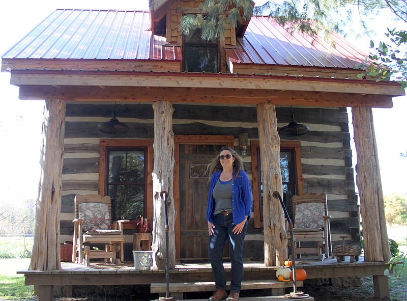 Patti Vonder Haar stands proudly in front of her realized lifelong dream, Patti's Place. The log cabin retreat is officially open for guests to enjoy the peaceful bridge between life and nature.