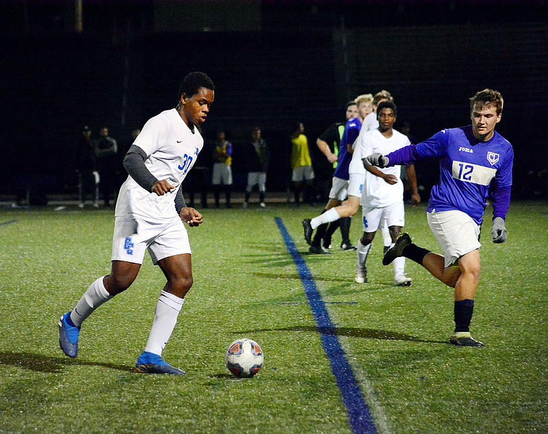 Mark Echekwu of Capital City dribbles the ball during Tuesday night's Class 3 District 9 Tournament game against Camdenton at the Crusader Athletic Complex.