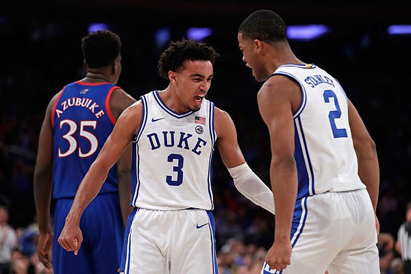 Duke guard Tre Jones (3) and guard Cassius Stanley (2) react after a basket during the second half of Tuesday's game against Kansas in New York.