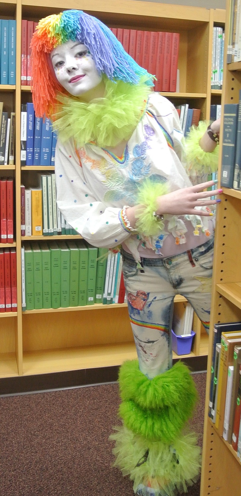 Halloween at a library brings out first-class clowns. Fifteen-year-old Atlanta  library volunteer Chambee Kathleen did her part by appearing and disappearing among the volumes at the library's Halloween party.
