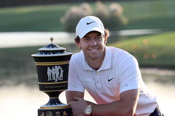 Rory McIlroy poses with the trophy after winning the HSBC Champions on Sunday at the Sheshan International Golf Club in Shanghai.