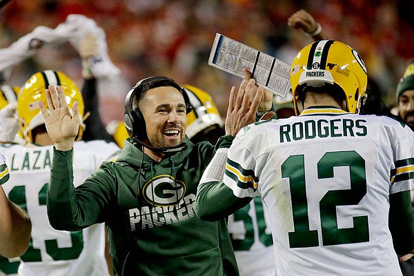 Packers head coach Matt LaFleur celebrates with quarterback Aaron Rodgers after a touchdown during a game last month against the Chiefs at Arrowhead Stadium.