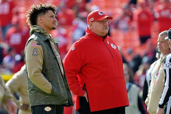 Chiefs quarterback Patrick Mahomes stands with head coach Andy Reid before a game against the Vikings earlier this month in Kansas City.