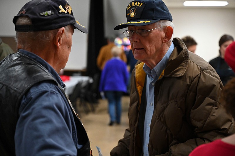 Robert Row and Bill Lavender talk to each other at the 20th annual Salute to Veterans on Friday at Williams Memorial United Methodist Church in Texarkana, Texas. The event served lunch to veterans and provided guests the chance to earn door prizes.
