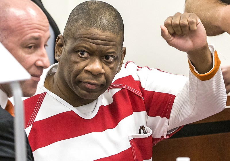 FILE - In this Oct. 13, 2017, file photo, death row inmate Rodney Reed waves to his family in the Bastrop County District Court in Bastrop, Texas. Supporters for Reed, who's facing lethal injection in less than two weeks for a murder he says he didn't commit, are mounting a final push in the courts and on social media to stop his execution, which is being called into question by lawmakers, pastors, celebrities and the European Union.  (Ricardo B. Brazziell/Austin American-Statesman via AP, File)