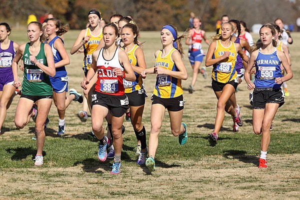 Fatima senior Kendall Haller (center) is flanked by senior teammates Alexis Fischer (left) and Sierra Sankey (right) at the start of Saturday's Class 2 girls state cross country championships at Gans Creek Cross Country Course in Columbia.