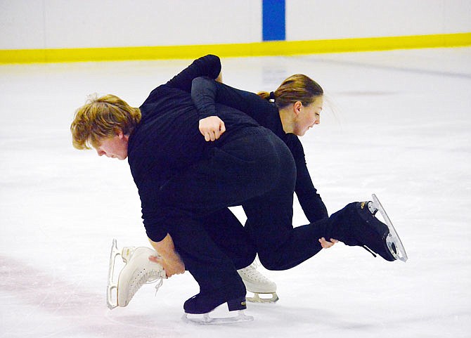 Wyatt Prosch, 15, of Holt Summit, and Mylee Hawkins, 13, of New Bloomfield, practice their routine Thursday at Washington Park Ice Arena. The pair have been skating together for four years and will be competing in a Figure Skating Pairs Final next week in Allen, Texas. 