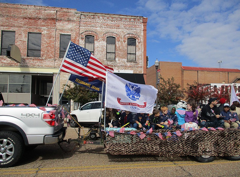 Local Boy Scouts participated Saturday in this year's Veterans Day parade, which proceeded westward on both East and West Broad streets before rolling north to the Downtown Post Office. Clear weather blessed the event's spectators.