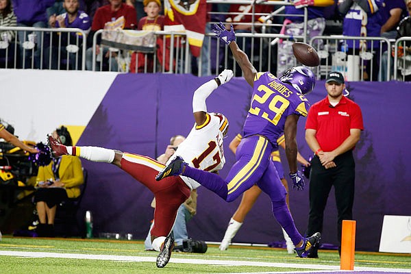 Vikings cornerback Xavier Rhodes breaks up a pass intended for Redskins wide receiver Terry McLaurin during a game last month in Minneapolis.