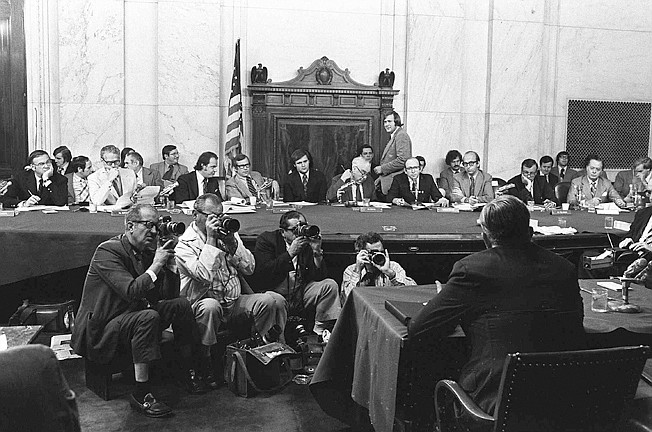 The Senate Watergate Committee hearings continue in this Aug. 3, 1973, file photo taken on Capitol Hill in Washington. From left are: Sen. Lowell P. Weicker, Jr; Sen. Edward J. Gurney, Fred Thompson, Sen. Howard H. Baker Jr; Rufus Edmisten, Sen. Sam Ervin; Sam Dash, Sen. Joseph M. Montoya, Sen. Daniel K. Inouye was absent. Testifying is Lt. Gen. Vernon Walters. In 1973, millions of Americans tuned in to what Variety called "the hottest daytime soap opera" — the Senate Watergate hearings that eventually led to President Richard Nixon's resignation. For multiple reasons, notably a transformed media landscape, there's unlikely to be a similar communal experience when the House impeachment inquiry targeting Donald Trump goes on national television starting Wednesday.