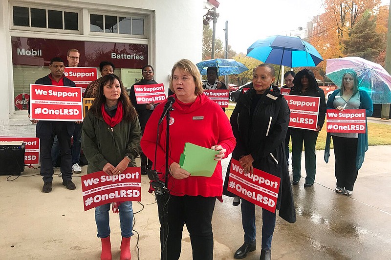 Teresa Knapp Gordon, president of the Little Rock Education Association, speaks at a news conference outside Little Rock Central High School in Little Rock, Arkansas on Monday, November 11, 2019. Gordon announced the association's members will strike for one day in response to the state stripping the union of its collective bargaining power and over Arkansas' control of the Little Rock School District. (AP Photo/Andrew Demillo)