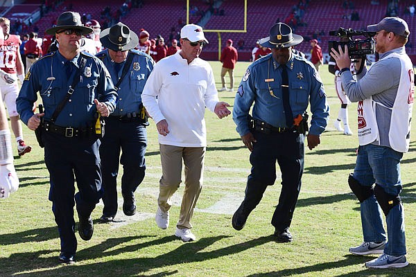 Arkansas coach Chad Morris heads to the locker room Saturday after the Razorbacks' 45-19 loss to Western Kentucky in Fayetteville, Ark.