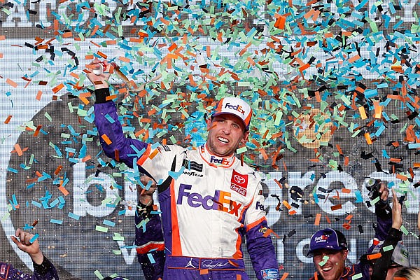 Denny Hamlin celebrates Sunday after winning the NASCAR Cup Series race in Avondale, Ariz.