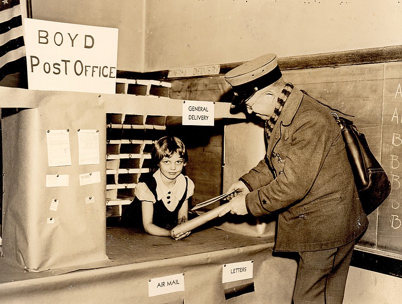 Walter Chalender, while serving as a mail carrier, poses for a photograph at a "temporary" post office constructed by students at Boyd Elementary School in Springfield in the early 1930s.
