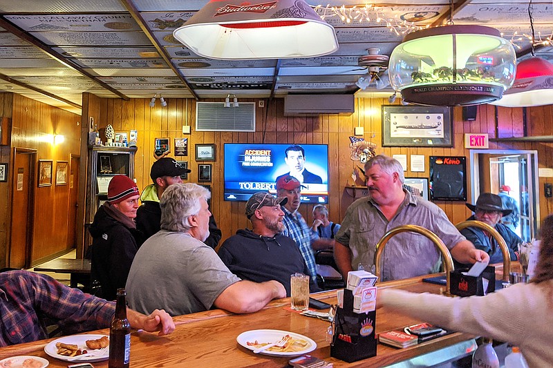 <p>Helen Wilbers/FULTON SUN </p><p>Veterans gather at the Fulton VFW to swap stories and memories while snow falls outside. The VFW hosted a Veterans Day open house and remembrance ceremony Monday.</p>