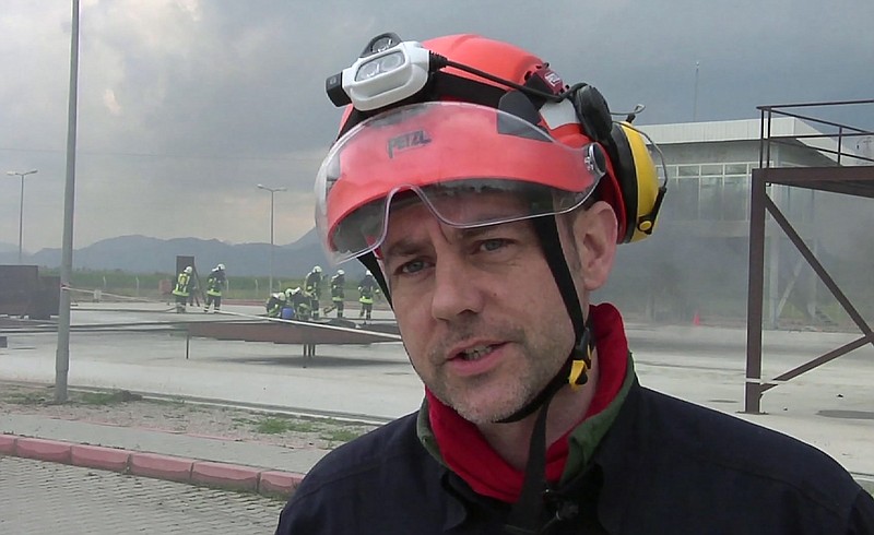 FILE - In this image taken from file video, showing James Le Mesurier, founder and director of Mayday Rescue, talks to the media during training exercises in southern Turkey, March 19, 2015.  Turkey's state-run news agency report Monday Nov. 11, 2019, that a former British army officer who helped found the "White Helmets" volunteer organisation in Syria, has been found dead in Istanbul. (AP Photo, FILE)