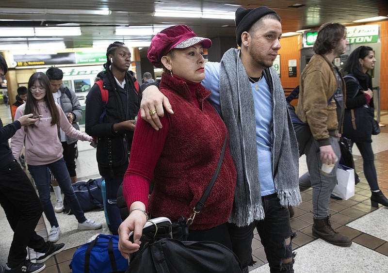 Luz Aurora Vidal and her son, Martín Batalla Vidal, line up to take a bus to Washington, Monday, Nov. 11, 2019, in New York. Martin Batalia Vidal is a lead plaintiff in one of the cases to preserve the Obama-era program known as Deferred Action for Childhood Arrivals and has seen his name splashed in legal documents since 2016, when he first sued in New York. His case will be heard at the Supreme Court beginning Tuesday. (AP Photo/Mark Lennihan)