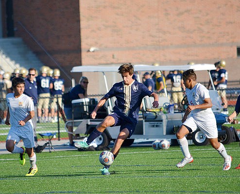Luke Hynes of Helias dribbles the ball during a game last month at the Crusader Athletic Complex.
