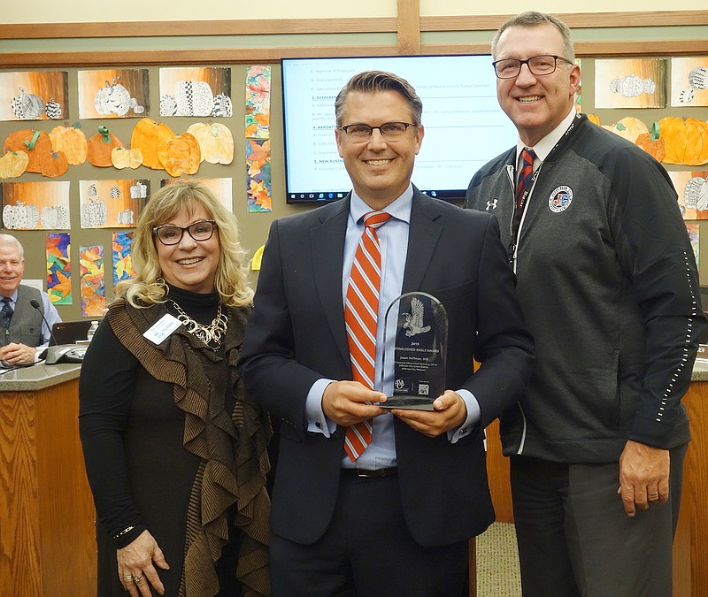 Missouri Association of School Business Officials Executive Director Kim Cranston posed Monday with Jefferson City School District Chief Finance and Operations Officer Jason Hoffman and Superintendent Larry Linthacum. Hoffman received the 2019 Distinguished Eagle award.