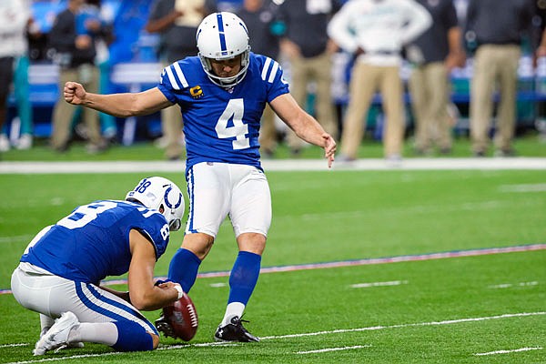 Colts kicker Adam Vinatieri attempts a field goal from the hold of Rigoberto Sanchez during Sunday's game against the Dolphins in Indianapolis