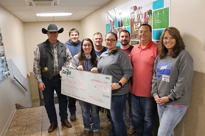 Representatives with Cargill, including California Area Chamber of Commerce President Blake Howard, presented Moniteau County Toys for Tots Program Coordinator Dan Mesey with a $500 donation Nov. 6, 2019.