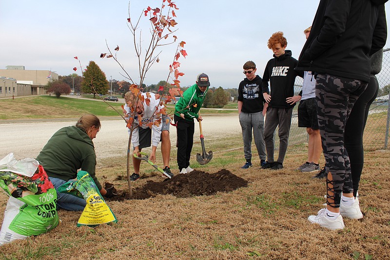 <p>Democrat photo/Austin Hornbostel</p><p>Representatives from Sports Locker Magazine helped to coordinate a tree planting and dedication in honor of the late Anthony Bertucci Nov. 6 at Russellville High School. Bertucci, a former Russellville student, died in a multiple fatality crash Sept. 3.</p>