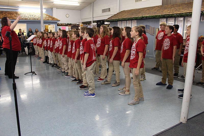 <p>Austin Hornbostel/For the News Tribune</p><p>California Elementary School’s California Kids choir perform Monday at the Heroes Outreach Program’s Veterans Day breakfast. The group sang “The Star Spangled Banner” and Bruno Mars’ “Count On Me.”</p>