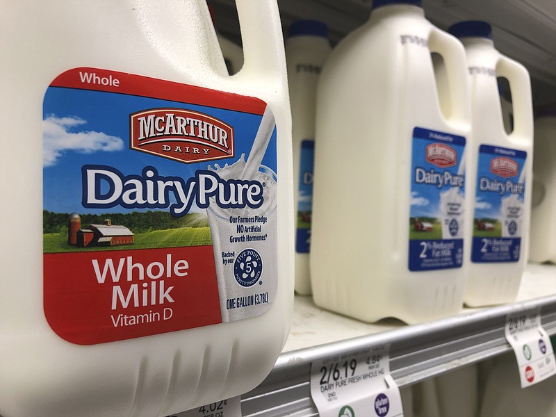 Jugs of McArthur Dairy milk, a Dean Foods brand, are shown at a grocery store, Tuesday, Nov. 12, 2019, in Surfside, Fla. Dean Foods, America's biggest milk processor, filed for bankruptcy Tuesday amid a steep, decades-long drop-off in U.S. milk consumption blamed on soda, juices and, more recently, nondairy substitutes. (AP Photo/Wilfredo Lee)