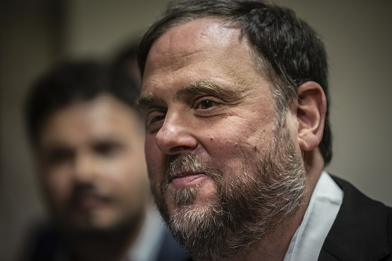 FILE - In this Monday, May 20, 2019 file photo, the leader of the Catalonian ERC party Oriol Junqueras leaves after collecting his credentials at the Spanish parliament in Madrid, Spain. A legal adviser at the EU's highest court said on Tuesday Nov. 12, 2019, that it should be down to the European Parliament, and not to Spain, to decide whether jailed Catalan leader Oriol Junqueras can serve as a European lawmaker. (AP Photo/Bernat Armangue, File)