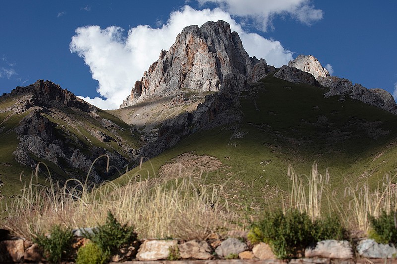 Peaks reach toward the sky in Angsai, an area inside the Sanjiangyuan region in western China's Qinghai province on Sunday, Aug. 25, 2019. Ringed by the world's tallest mountain ranges, the region long known as "the rooftop of the world" is now in the crosshairs of China's latest modernization push. But this time, the Chinese government wants to set limits on the region's growth in order to implement its own version of one of the U.S.'s proudest legacies _ a national park system. (AP Photo/Ng Han Guan)