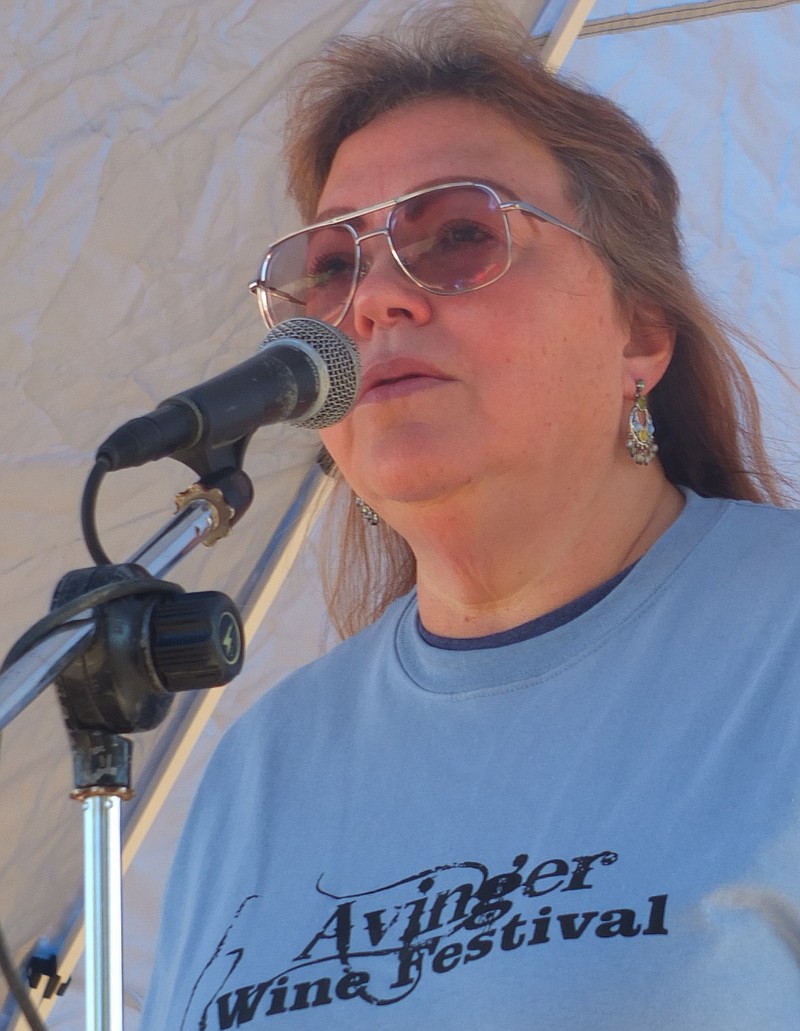 Brenda Mastro of Avinger, Texas, often gets asked to sing at many public events. She's shown here performing at the recent Avinger Wine Festival.
