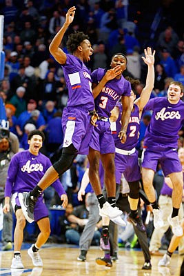 Evansville celebrates after Tuesday night's win against Kentucky in Lexington, Ky.