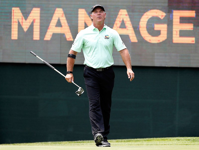  In this May 31, 2019 file photo Scott McCarron reacts after missing a putt on the 17th green during the first round of the PGA Tour Champions Principal Charity Classic golf tournament in Des Moines, Iowa. McCarron won the Charles Schwab Cup on Sunday, Nov. 10, 2019 in Phoenix while waiting in the clubhouse. (AP Photo/Charlie Neibergall)