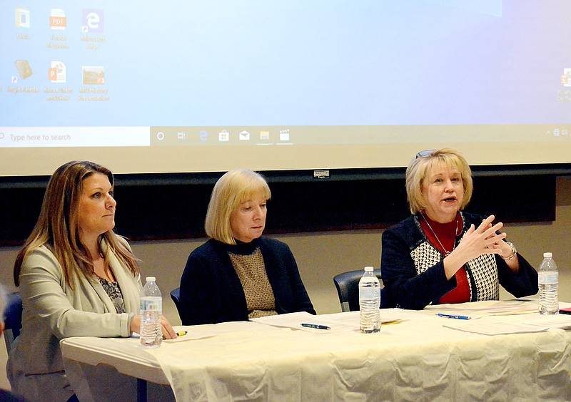 Connie Mihalevich, with MU Health Care, right, speaks on a panel of health professionals Tuesday beside Katie Reichard, with Missouri Primary Care Association, left, and Mary Becker, with Missouri Hospital Association, as they discuss Medicaid expansion at Missouri River Regional Library. 