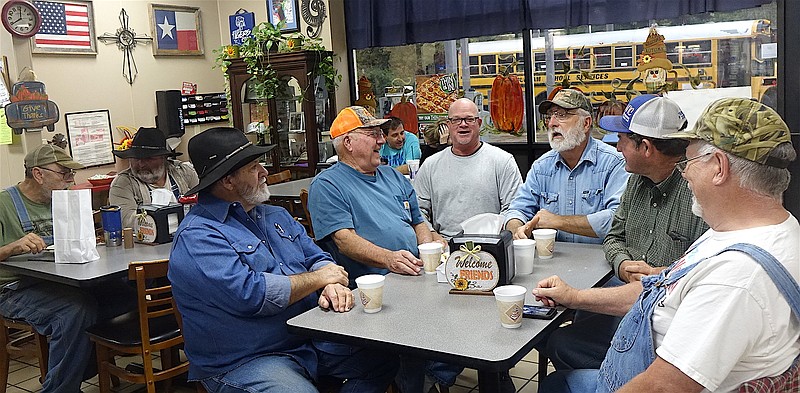 "Sure, take our picture," say, from left, James Martin, Pete Allen, Stacy Holland, Frank Washington, Eddie Frank Price and Doug Glover of the morning group.
