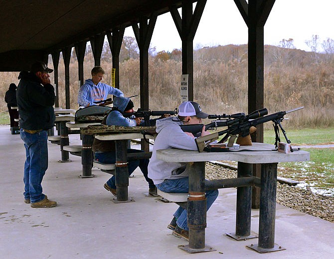 Shooters sight in their rifles Wednesday at Scrivner Road Shooting Range in Russellville. The November firearms deer-hunting season will open this Saturday.