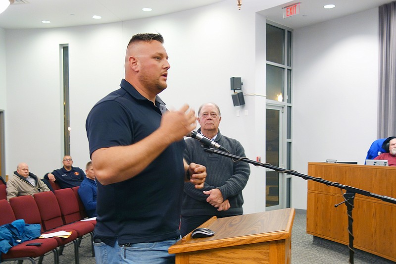 Sgt. Lance Reams of the Fulton Police Department flaunts his No-Shave November stubble while talking to Fulton City Council members. This year, proceeds will support Fulton Bright Futures.