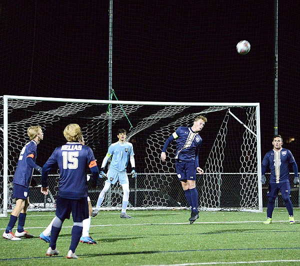 Kaleb Wilson of Helias heads the ball away from the goal during Wednesday's Class 3 sectional game against Glendale at the Crusader Athletic Complex.