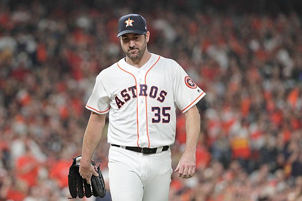 Astros pitcher Justin Verlander walks back to the dugout after the Nationals scored a run during the first inning of Game 6 of the World Series last month in Houston.