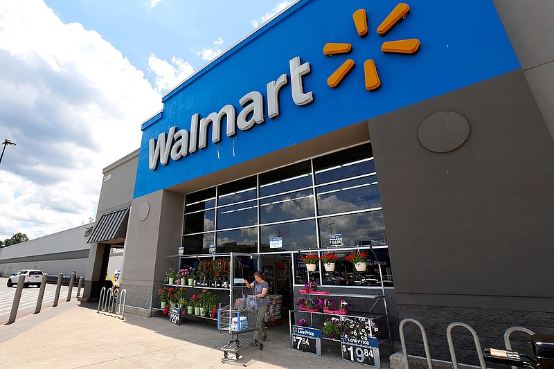 This June 25, 2019, file photo shows the entrance to a Walmart in Pittsburgh. Walmart reports its third quarter earnings on Thursday, Nov. 14. (AP Photo/Gene J. Puskar, File)