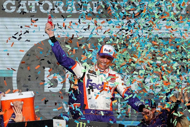 Denny Hamlin celebrates in Victory Lane after winning the NASCAR Cup Series auto race Sunday, Nov. 10, 2019, in Avondale, Ariz. (AP Photo/Ralph Freso)