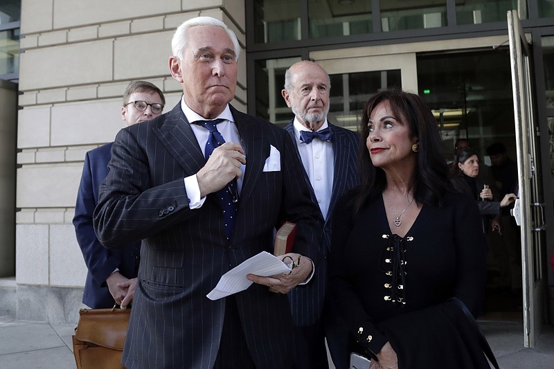 Roger Stone, left, with his wife Nydia Stone, leaves federal court in Washington, Friday, Nov. 15, 2019. Stone, a longtime friend of President Donald Trump, has been found guilty at his trial in federal court in Washington. (AP Photo/Julio Cortez)