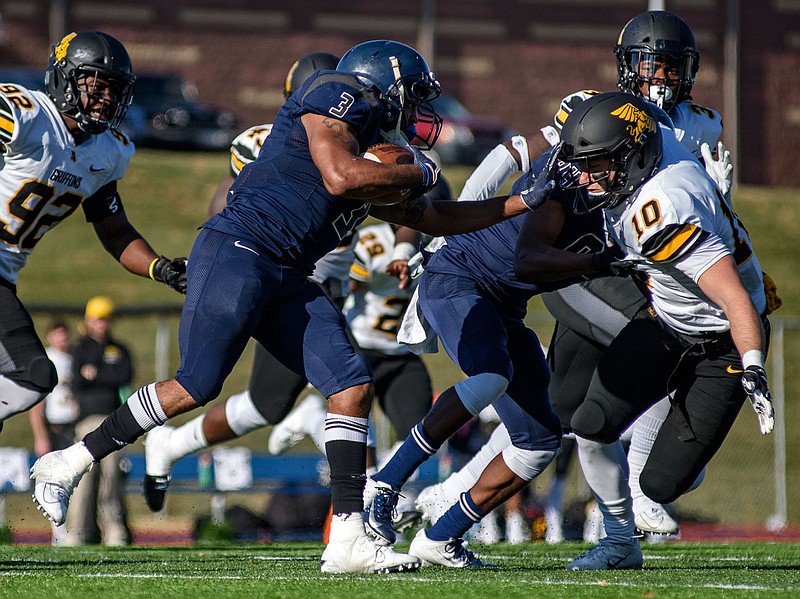 Lincoln running back Hosea Franklin stiff arms Missouri Western defensive back Drew Sachen while looking for room to run in the second half of Saturday's season-ending loss for the Blue Tigers at Dwight T. Reed Stadium.